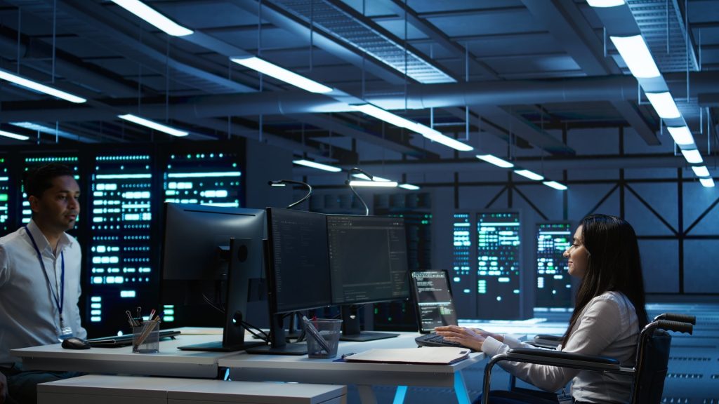 Barcelona data center professionals monitoring servers in a high-tech facility, ensuring sustainable and secure digital infrastructure.